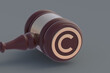 Copyright symbol on judge hammer. Intellectual property concept. 3d render