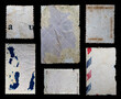 collection of blank vintage postage stamps with different size and texture variation isolated on black background. back side
