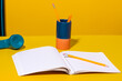 © ADDICTIVE STOCK - Colorful school supplies near phone