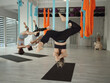 © EASY 2 SHOOT/Stocksy - Aerial hammock yoga class