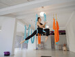 © EASY 2 SHOOT/Stocksy - Aerial yoga indoor