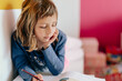 © Albert Martinez/Stocksy - Girl doing homework