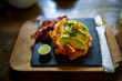© Jovo Jovanovic/Stocksy - Healthy meal with avocado on slate serving board