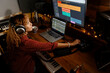© Jimena Roquero/Stocksy - Music producer working at home studio using audio interface
