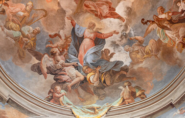  DOMODOSSOLA, ITALY - JULY 19, 2022: The baroque fresco of Assumption in cupola of the church Chiesa dei Santi Gervasio e Protasio by Lorenzo Peretti (1774 – 1851).