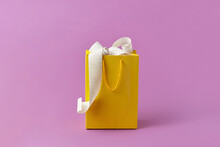 Pay Receipt In Yellow Bag On Pink Background.