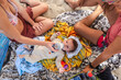 © Luis Herrera/Stocksy - top view of baby drinking milk from a feeding bottle