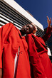 © Tania Cervian/Stocksy - Multiracial girlfriends in red clothes on street