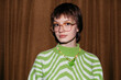 © Viktor Solomin/Stocksy - Pretty vintage girl in glasses looking at camera, wearing glasses
