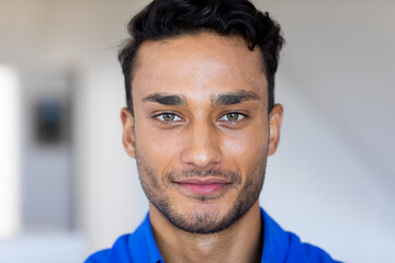 Portrait of happy biracial man looking at camera and smiling