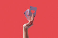 Cards With Heart Hollows Held By Woman's Hand.