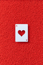 Ace Card With Heart On Red Balls Background.