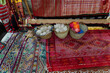 © Mauro Grigollo/Stocksy - Carpets on sale in a Moroccan shop