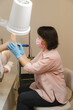 © Alina Hvostikova/Stocksy - Beautician doing procedure on clients feet