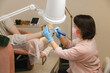 © Alina Hvostikova/Stocksy - Beautician doing procedure on clients feet