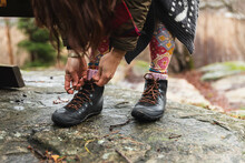 Close Up Of A Unrecognizable Person Tying Cordons In A Hiking Boots