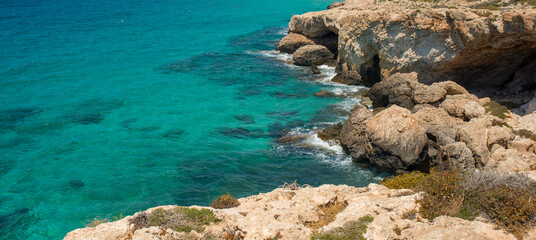 Wall Mural - beautiful sea summer background banner with shore sky and rocks