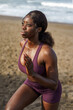 © Jovo Jovanovic/Stocksy - Woman in sportswear running on the spot at the beach