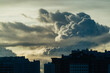 © Natalia Mishina/Stocksy - Cumulus clouds over the city.