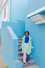 Person With Blue House