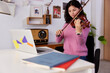 © Javier Díez/Stocksy - Female violinist during online lesson at home