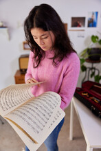 Female Musician Reading Sheet Music