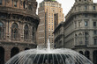 © Marco Reggi/Stocksy - fountain in the city with old buildings
