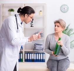 Poster - Female alcoholic visiting young male doctor