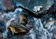 © Liam Grant/Stocksy - Flowing water on a river in winter.