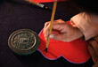 © ChaoShu Li/Stocksy - Make traditional Chinese New Year brush calligraphy decorations
