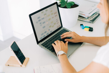 Female hands typing on laptop