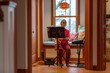 © Raymond Forbes LLC/Stocksy - Young boy portrait  at home playing saxophone  instrument