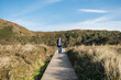 © Daniel Gonzalez/Stocksy - Man walking and admiring view in sunset