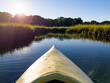© Raymond Forbes LLC/Stocksy - Kayak marsh landscape  in beautiful river  nature summer sunset