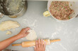 © Gabriel (Gabi) Bucataru/Stocksy - Grandma's hands rolling dumpling dough
