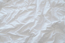 pastel violet wrinkled bed sheet