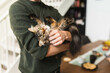 © Diego Martin/Stocksy - Young man with cat