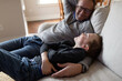 © Kelly Knox/Stocksy - father and son watching tv
