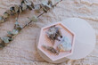 Beautiful pink flat lay of crystals with crystal dishes and eucalyptus
