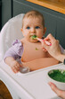 © AUDSHULE/Stocksy - Introducing solid food to baby