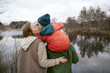 © Anna Artemenko/Stocksy - family walking by the lake