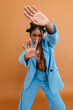 © Tania Cervian/Stocksy - Black woman gesticulating and looking at camera