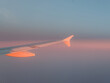 © Laura San Segundo/Stocksy - Wing of an airplane flying on the sky