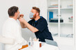 © Studio Firma/Stocksy - Doctor Examining Senior Man