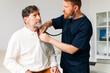 © Studio Firma/Stocksy - Doctor Examining Senior Man