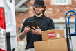 © Sean Locke/Stocksy - Shipment: Delivery Man Confirms Info