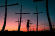 © Ibai Acevedo/Stocksy - Standing woman silhouette at symbolic trees graveyard