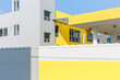 © Jeongho Byeon/Stocksy - Close-up of a building painted yellow.