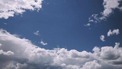 Wall Mural - 4k Gently Cloud Sky Blue Moving In Blue Sky Abstract Cloud. Fantasy Clouds. Flight Of Fancy. Colorful Cloudy Dramatic Sky With Fluffy Clouds. Natural Background. Time Lapse Time-lapse. Weather Concept