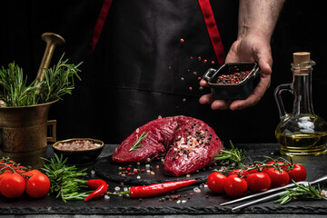 Poster - chef hands cooking Tenderloin fillet with rosemary and spices. Preparing fresh beef steak ready to cook, Restaurant menu, dieting, cookbook recipe. place for text